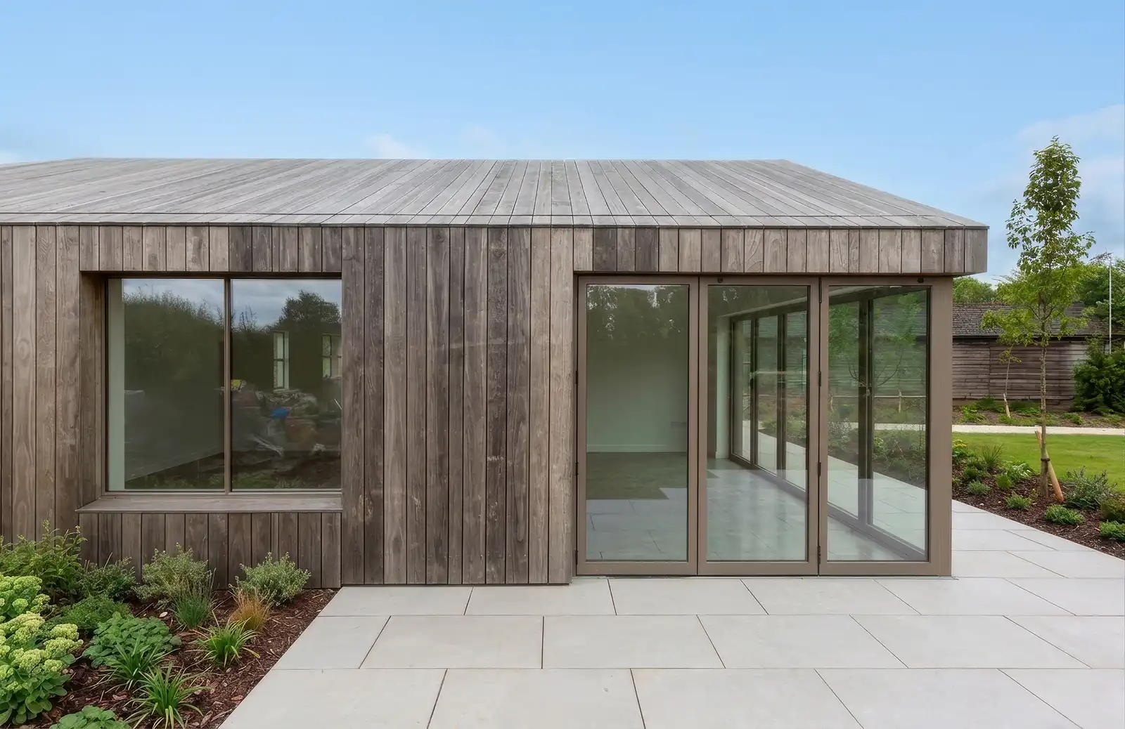 Timber-clad garden room demonstrating precise architectural detailing