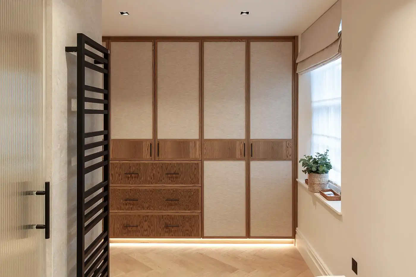 Custom cabinetry aligned with architectural structure London house renovation