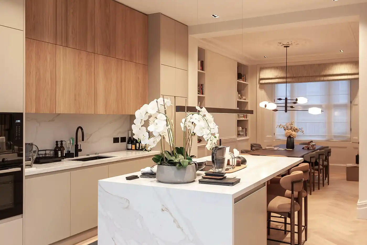 Kitchen island forming central feature in open plan interior London house